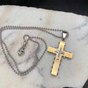 Stainless steel cross cz accents.